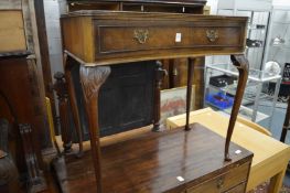 A walnut concave fronted single drawer side table.