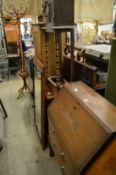 An oak bureau, a small cupboard, a pine cupboard, a chiffonier and a mirror.