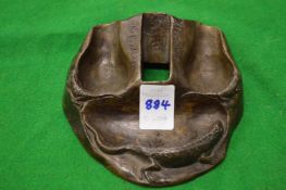 A small bronze stand.