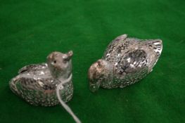 A pair of model ducks.