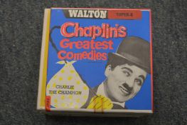 Six Super 8 film reels.