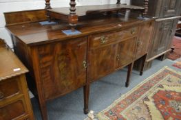 A large mahogany sideboard.