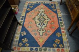 A modern eastern rug with stylized decoration, 200cms x 130cms.