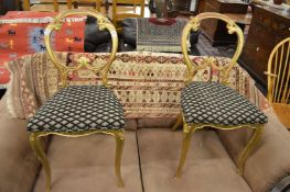 A pair of Gillow carved giltwood occasional chairs.