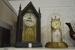 A mantle clock and an anniversary style clock, lacking pendulum.