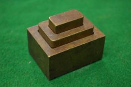 A graduated set of three Chinese bronze seals.