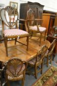 A set of eight Sheraton style mahogany dining chairs, two with arms.