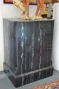 A faux marble pedestal stand.