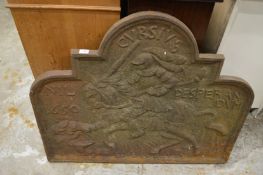 A large cast iron fire back.