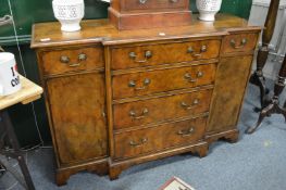 A good reproduction walnut breakfront small sideboard.