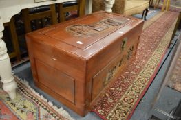 A Chinese carved camphor wood coffer.