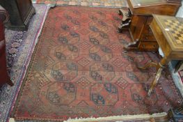 A Persian rug, red ground with three rows of six gulls, 220cms x 185cms.
