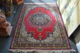 A modern machine-made Persian style rug, 200cms x 137cms.