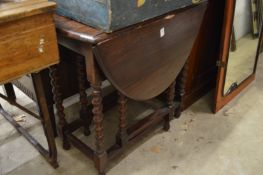 An oak drop leaf gate leg table.