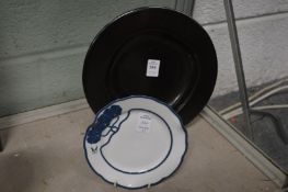 An Austrian circular pottery dish together with a small porcelain dish.