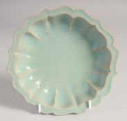 A CHINESE CELADON GLAZE PETAL FORM BOWL, 18cm diameter.