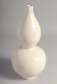 A CHINESE CREAM GLAZE DOUBLE GOURD VASE, 28.5cm high.