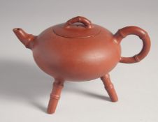 AN UNUSUAL CHINESE YIXING TRIPOD TEAPOT, with impressed marks to inner lid and base, 12cm high.