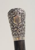 A FINE ANTIQUE RHINO HORN WALKING CANE with chased silver handle, 90cm long.