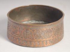 A FINE 16TH CENTURY SYRIAN MAMLUK ENGRAVED COPPER BOWL, with inscribed panels and decorative motifs.