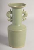 A CHINESE CELADON GLAZE TWIN HANDLE VASE, 26cm high.