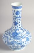 A CHINESE BLUE AND WHITE PORCELAIN VASE, finely painted with dragons and flower heads, the base with