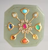 AN INDIAN MUGHAL BEJEWELLED JADE PLAQUE, with gold central floral motif inset with various stones,