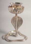 A WHITE METAL COBRA FORM CANDLESTICK, with engraved detail all over, 24cm high.