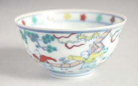 A CHINESE DOUCAI EGGSHELL PORCELAIN CUP painted with children playing, the base with six-character