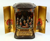A SUPERB LACQUERED AND CARVED WOOD BUTSUDAN HOME ALTER, the doors opening to reveal many carved