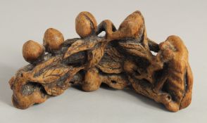 A CHINESE CARVED BAMBOO BRUSH STAND, 16.5cm long.