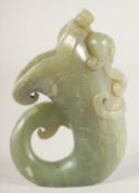 A CHINESE JADE HORN SHAPE LIBATION CUP, with carved chilong to the side, 11cm high.