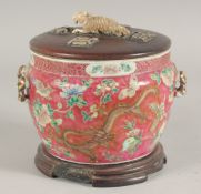 A CHINESE FAMILLE ROSE PORCELAIN CIRCULAR BOWL AND COVER ON STAND, the exterior decorated with