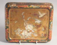 A JAPANESE LACQUERED WOOD AND MOTHER OF PEARL INLAID BOX, the hinged lid with mother of pearl flora,