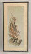 A 20TH CENTURY JAPANESE TEXTILE OF A TIGER, framed and glazed, 67cm x 34cm.
