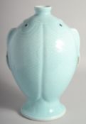 AN UNUSUAL CHINESE CELADON GLAZE TWIN-FISH FORMED VASE, six-character mark to base, 33.5cm high.