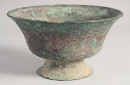 AN EARLY SELJUK BRONZE FOOTED BOWL, inscribed with the name of the owner, possibly 13th/14th