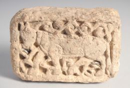 A RARE 12TH/13TH CENTURY PERSIAN SELJUK CLAY BRICK, depicting a bull, 12.5cm x 9cm.