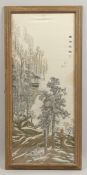 A 20TH CENTURY CHINESE EMBROIDERED TEXTILE, depicting a mountain view, inscribed, framed and glazed,