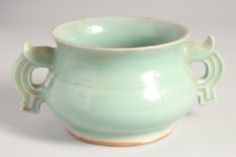 A CHINESE CELADON GLAZE TWIN HANDLE CENSER, 20cm wide (handle to handle).