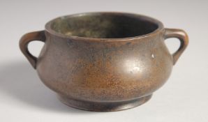 A CHINESE BRONZE TWIN HANDLE CENSER, six-character mark to base, 12cm wide (handle to handle).
