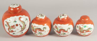 A GARNITURE OF FOUR GINGER JARS AND COVERS, painted with dragons, various sizes (4)