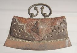 A TIBETAN MECHA FIRE STRIKER, with leather pouch and metal mounts, 12.5cm wide.