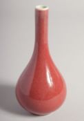 A SMALL CHINESE SANG DE BOEUF BOTTLE VASE, the base with Qianlong mark, 15cm high.