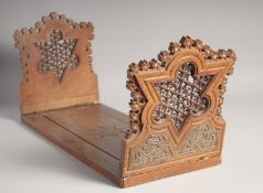 AN OTTOMAN HARDWOOD FOLDING BOOKCASE / SHELF, with mashrabiya ends, 53cm long.