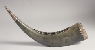 A METAL-MOUNTED BOVINE HORN, the mounts with engraved and chased foliate decoration, 37cm long.