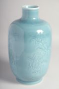 A CHINESE BLUE GLAZE PORCELAIN VASE, with carved floral decoration to the body, the base with six-