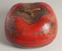 A LARGE CHINESE LACQUERED WOOD LIDDED FOOD BOX, in the form of a pumpkin, 36cm wide (at longest