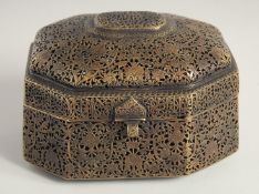 AN INDIAN OPENWORK BRASS LIDDED CASKET, with openwork floral decoration all over, the hinged lid
