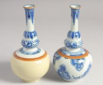 TWO SMALL CHINESE BLUE AND WHITE PORCELAIN VASES, each 17cm high.